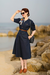 a lady in a denim top and a denim skirt